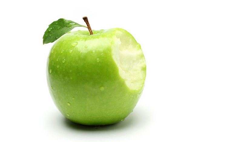 Ein angebissener grüner Apfel, der an das Apple-Logo erinnert