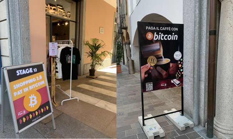 Schilder in Lugano mit Hinweis auf Zahlungsmöglichkeit mit Bitcoin