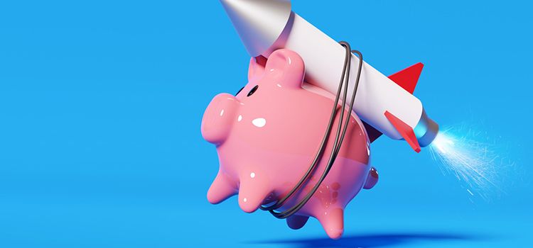 Ein Sparschwein mit umgebundener Rakete startet durch
